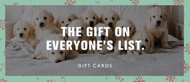 A pile of yellow lab puppies, The gift on everyone's list gift cards